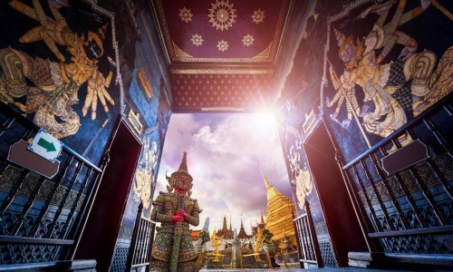 Travel concept, Giant statue at Temple Wat Pra Kaew, Grand Palace, Bangkok Thailand